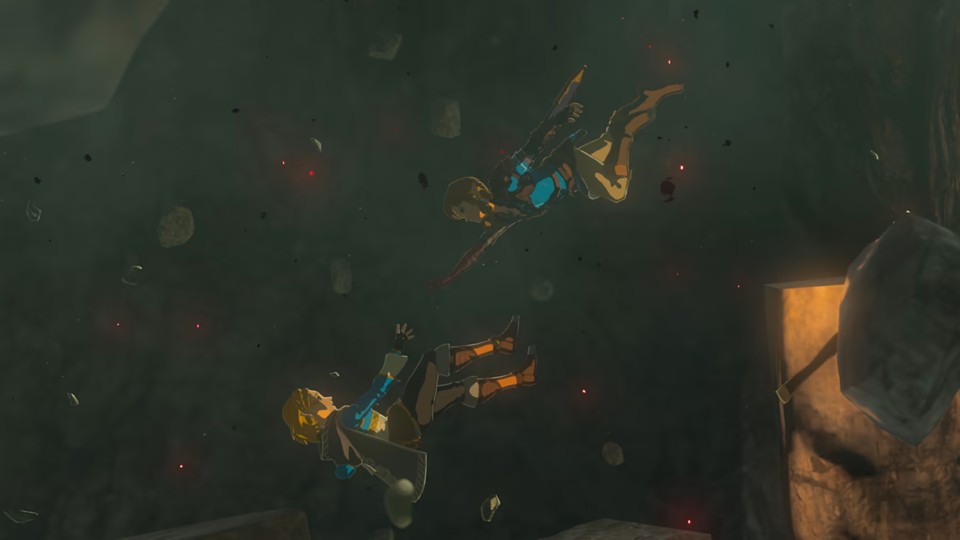 Princess Zelda falls backwards, Link falls after her, both trying to reach each other, in a dark cave.