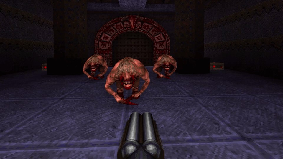 First-person view, with only a double-barreled shotgun and no visible UI. Three fiends, ape-like enemies, with dirty beige skin, single talon-like hands, hoofed legs, mouths with huge teeth occupying half of their heads, stand between the player and the exit gate.