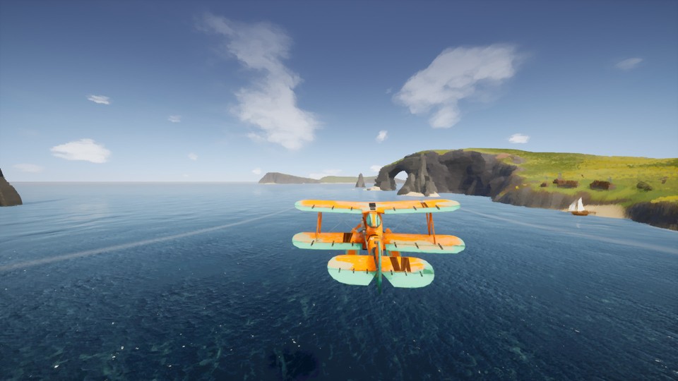 Yellow and white biplane flying over calm sea. On the right is a land mass with cliffs, an arch over the water, green fields and a small sailboat near a sandy beach.