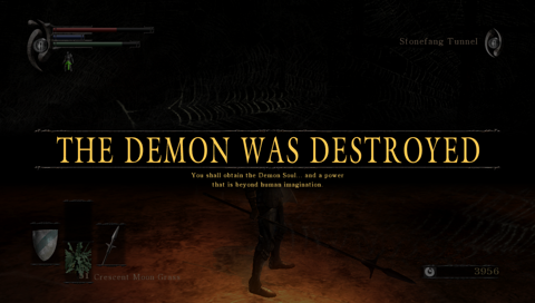 The screen is significantly darkened. UI, the bottom half of a character is visible, but it’s hard to make out details. Large text across the screen says “The demon has been destroyed” in capital letters.