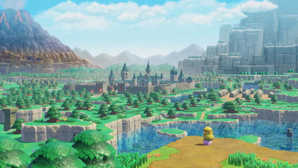 Princess Zelda, a blonde lady with pointed ears, wearing a white dress with blue trim, stands on the edge of a sunlit world. There are mountains in the distance. In front of her is a river with clear water, then a forest with some roads in it. In the middle of it all is a town, surrounded by a moat, with a castle in it. Everything is somewhat blocky and cartoony.