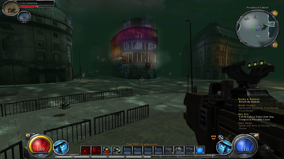 Piccadilly Circus, that famous London square with big curved screens. Everything is dilapidated here: the screens and windows are broken, and the whole place is gloomy and gray, including the dark skies above. The view is in the first person. Our character holds a bulky, futuristic-looking machine gun. There are also UI elements across the screen, including a minimap and an action hotbar.