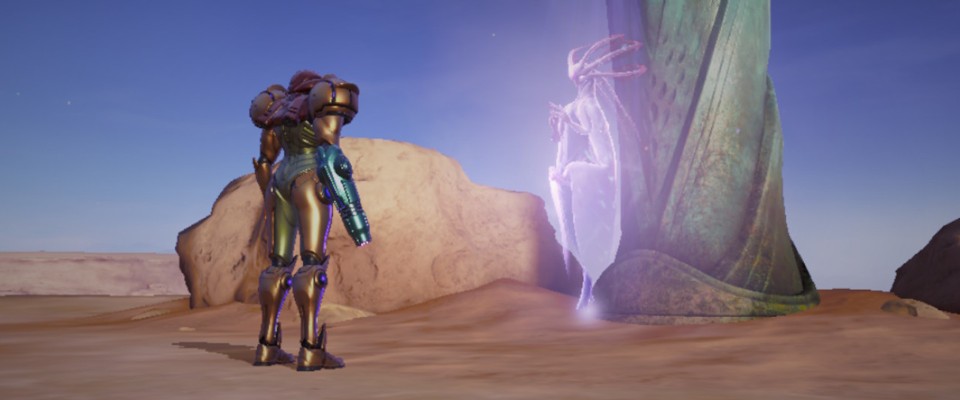 Samus, wearing her classic red and gold Power Suit, stands in a desert. In front of her stands a stone statue. In front of the statue is a hologram of a slender, four-armed humanoid. Its head resembles an axolotl, with six tentacles stick out from it, but almost featureless face of a grey alien.