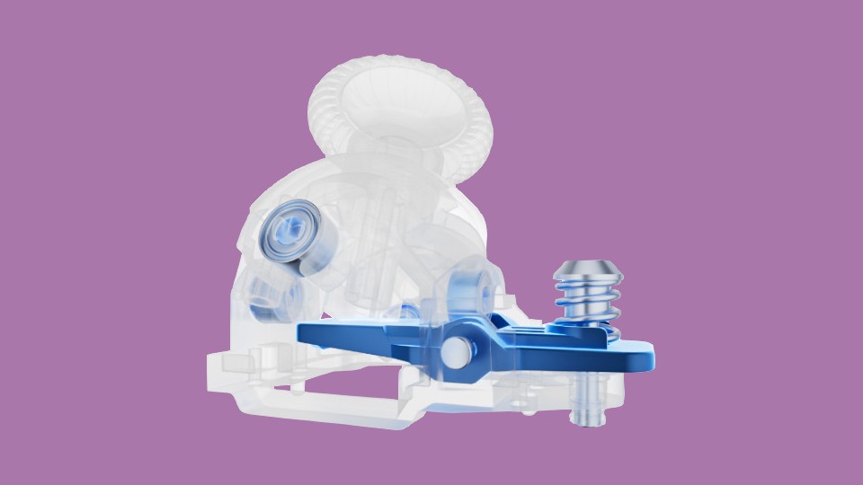 A transparent rendering of a gamepad stick. There are five blue parts that highlight the two axes to which the “bowls” from my explanation are connected. Another part is a sort of paddle that sits underneath the whole thing and is responsible for the tension.