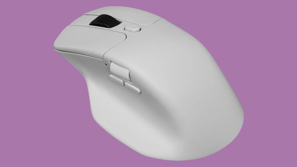 This white computer mouse has a black scroll wheel and is shaped to fit comfortably under the right hand. There is an additional button behind the scroll wheel, as well as an additional scroll wheel and two buttons on the left side where your thumb will rest.
